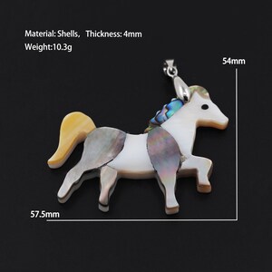 May include: A white, iridescent, shell horse pendant with a yellow tail. The pendant is 5.75 inches long and 5.4 inches wide. Material: Shells, Thickness: 4mm, Weight: 10.3g
