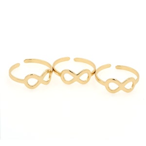 May include: Three gold infinity symbol rings. The rings are adjustable and can be worn on any finger.