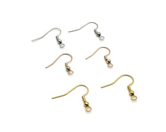May include: Four pairs of earring hooks with a small ball at the end. Two pairs are silver, one pair is gold, and one pair is rose gold.