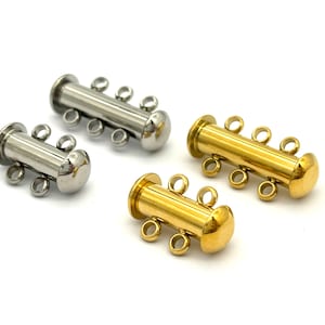 May include: Two silver and two gold magnetic clasps for jewellery making. Each clasp has four loops for attaching chains or cords.