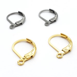 May include: Four earring hooks, two silver and two gold. The hooks are made of metal and have a spring-loaded clasp.
