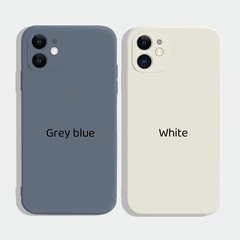 May include: Two silicone phone cases, one in grey blue and one in white. Both cases have a raised camera bump and the text "Grey blue" and "White" printed on them.
