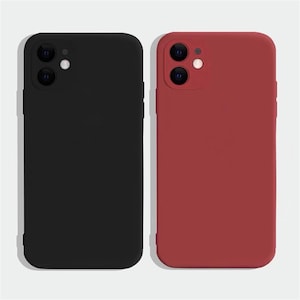 May include: Two silicone phone cases, one black and one red, designed for a smartphone with a triple camera lens.