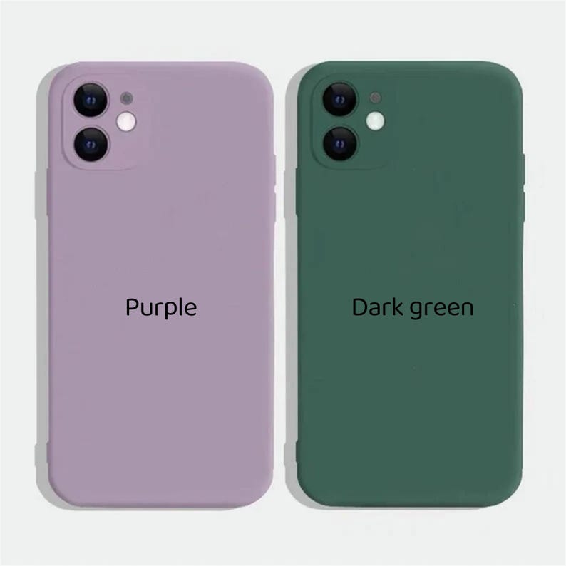 May include: Two silicone phone cases, one purple and one dark green. Both cases have a raised camera bump and the text "Purple" and "Dark green" printed on them.