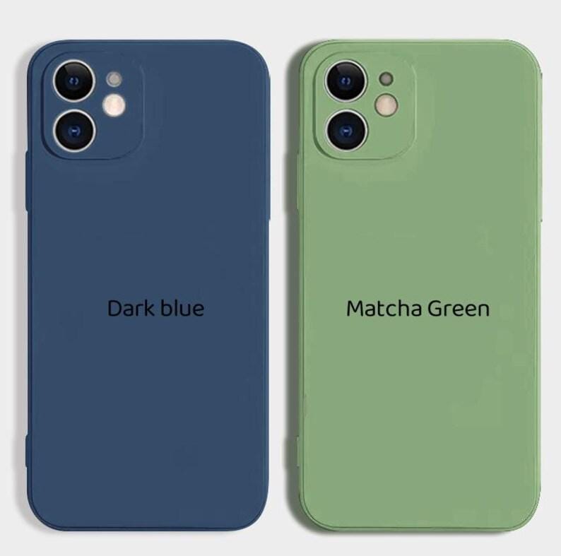 May include: Two silicone phone cases, one dark blue and one light green. The dark blue case has the text "Dark blue" printed on it. The light green case has the text "Matcha Green" printed on it.