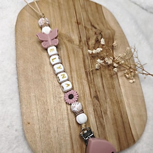 金色の花の文字が入ったシリコン製おしゃぶりクリップ - 女の子用シリコン製おしゃぶりクリップ - パーソナライズされた花のシリコン製おしゃぶりホルダー - クリエーション
