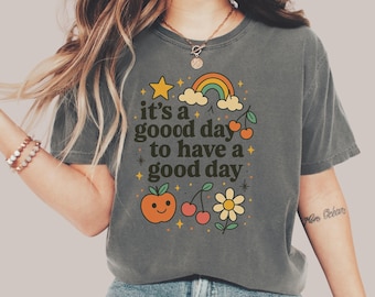 Camiseta con colores cómodos y vibras positivas, estilo retro con estampado de buen día