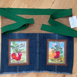 Upcycled half apron made from denim and cotton with garden-themed prints.