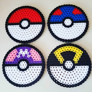 May include: Four colourful Pokeball coasters made with perler beads. The coasters feature red, blue, purple, and yellow designs.