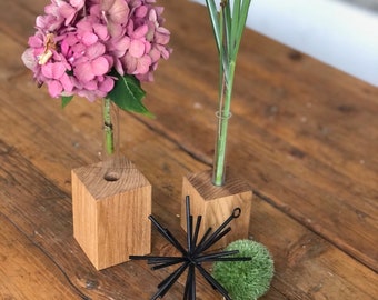 Wooden vase with a test tube