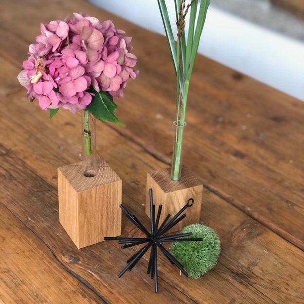 Wooden vase with a test tube