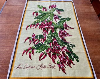 Paño de cocina vintage con flores de Nueva Zelanda y diseño de pico de kaka, recuerdo de la década de 1970.