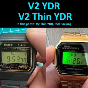 May include: Two Casio digital watches are displayed. One is black with a black band, the other is gold-toned with a gold band. Both watches show the time on a digital display. The text "V2 YDR" and "V2 Thin YDR" are at the top.