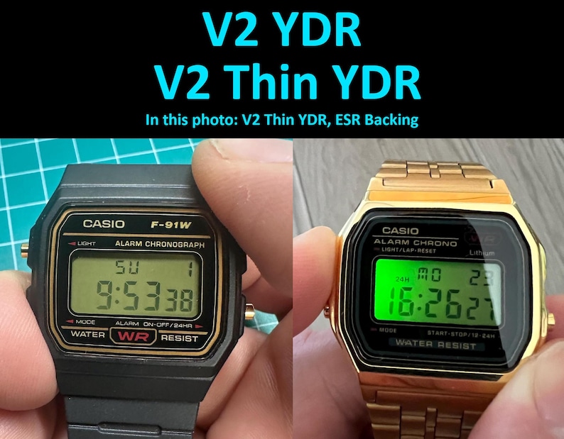 May include: Two Casio digital watches are displayed. One is black with a black band, the other is gold-toned with a gold band. Both watches show the time on a digital display. The text "V2 YDR" and "V2 Thin YDR" are at the top.