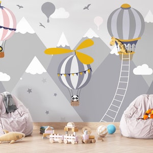 Adventure over the mountains with hot air balloons, Kid's room wallpaper with cute baby panda, giraffe, and lion cub