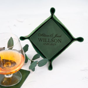May include: Green leather tray with a square insert. The insert is personalized with the text "Allison & Jacob WILLSON 12.05.2023".