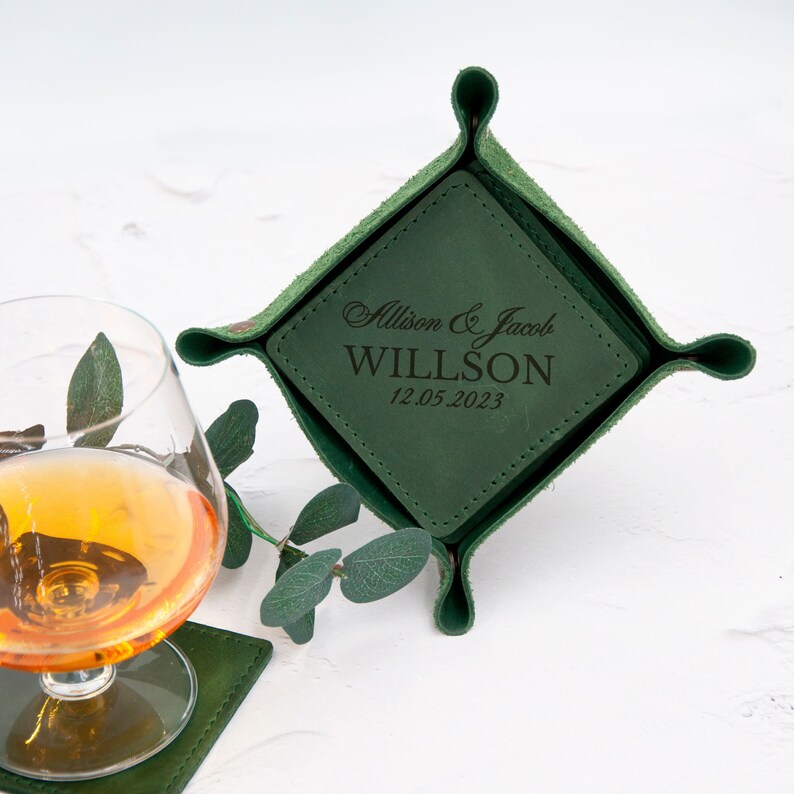 May include: Green leather tray with a square insert. The insert is personalized with the text "Allison & Jacob WILLSON 12.05.2023".