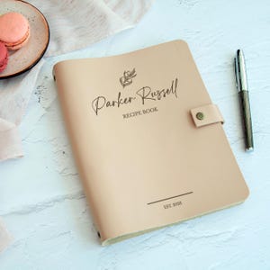 Minimalist beige personalized recipe book with custom family name engraving and olive branch, elegant gift for him cookbook