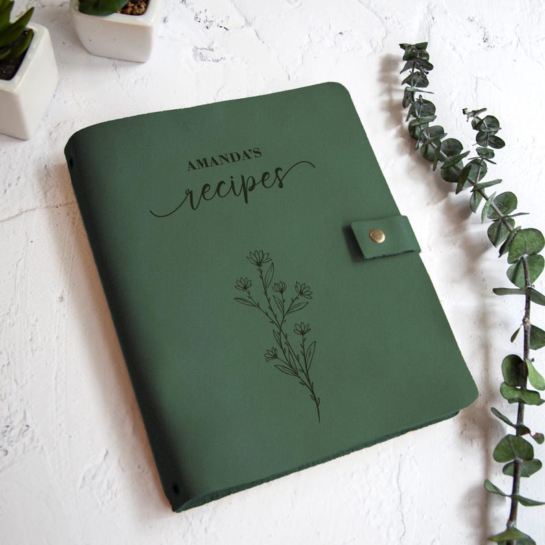 Leaf green recipe book with floral engraving and custom family name, personalized cookbook