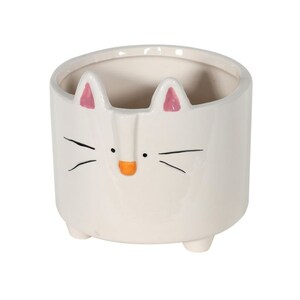 May include: White ceramic planter shaped like a cat with pink ears and an orange nose. The planter has a round opening at the top and three small feet.