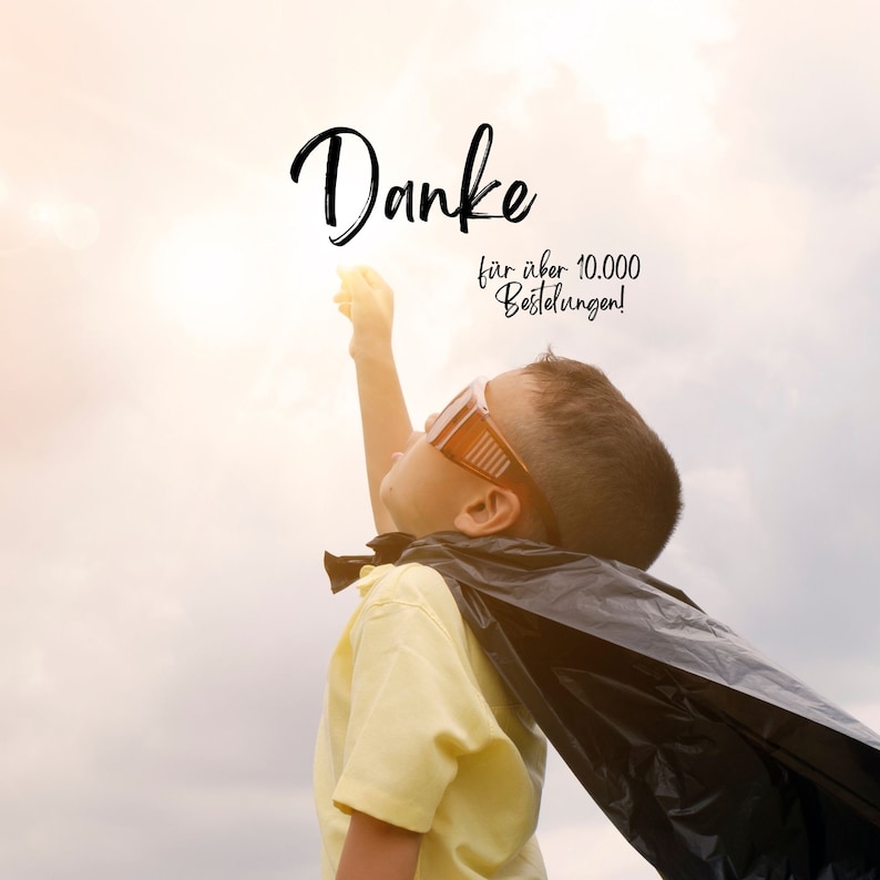 May include: A young person dressed as a superhero, wearing a black cape and goggles, reaches towards a bright light in a cloudy sky. The word "Danke" is written in cursive, with additional text below.