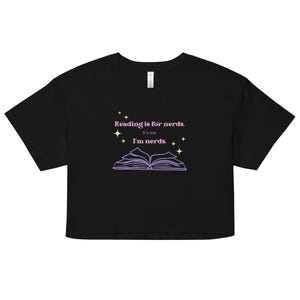 May include: Black cropped t-shirt with a pink graphic that says "Reading is for nerds. It's me. I'm nerds." and a purple outline of an open book with yellow stars.