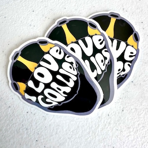 May include: Three black and yellow heart-shaped stickers with the text "I love cookies" in white letters.