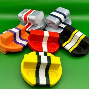 Front-3 stripe-yellow/forest green/white
Mid left-3 stripe-orange/purple/white
Mid center-1 stripe-red/white
Mid right-5 jersey stripe-black/yellow/white
Back right-5 helmet stripe-silk silver/red/white
Back left-3 stripe-silk silver/white/navy blue