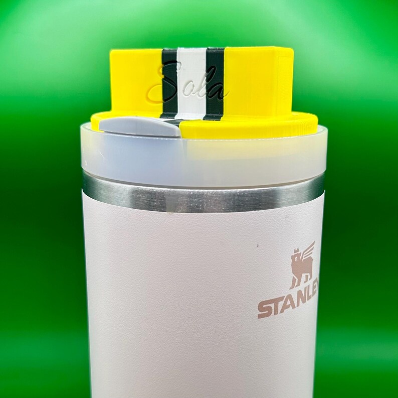 Standard 3 stripe in yellow/forest green/white 
On top of a 40 ounce Stanley Quencher