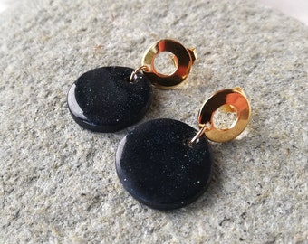Black and gold earrings made of polymer clay