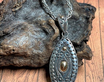Oxidized Silver and 18K Gold Pendant from Indonesia With 16 Inch Chain