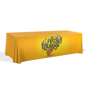 May include: Yellow table cover with a colorful graphic design featuring a guitar and the text "Festa Junina".
