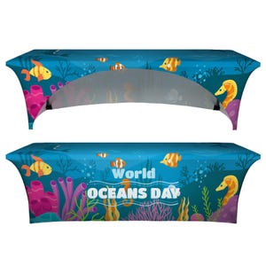 May include: A blue table cover featuring an underwater scene with cartoon fish, seahorses, and coral. The text "World Oceans Day" is prominently displayed. The cover is designed to fit a rectangular table.
