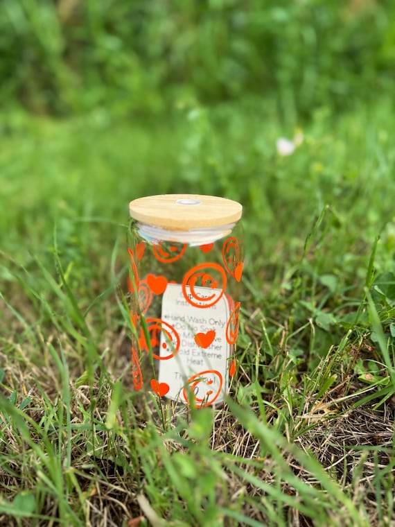 Orange smiley face glass tumbler