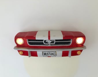 May include: Red and white Ford Mustang car front end wall decor with headlights and the word "MUSTANG" on the license plate.
