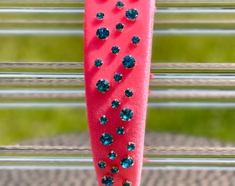 Hot pink padded headband with blue rhinestones