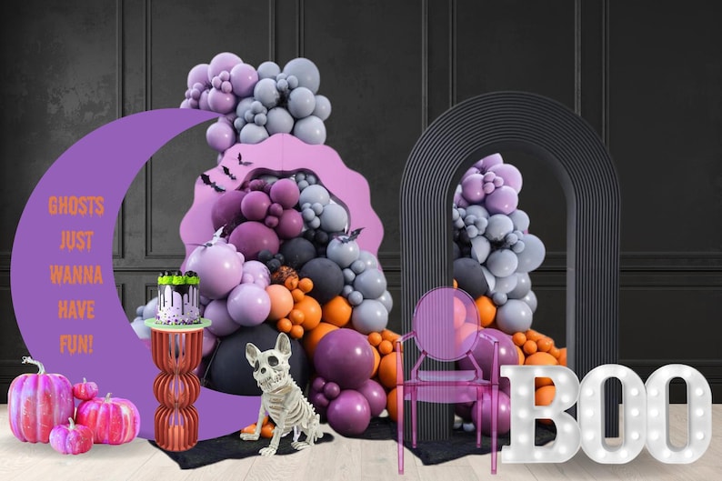 Halloween party event mockup made by a balloon artist and event planner. including light-up marqueeletters, a moon-shaped backdrop and a purple, black and orange balloon organic garland. Pumpkin prop, bats flying and and skeleton