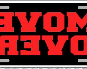 „Move Over“-Kennzeichen mit umgekehrter Schrift aus Metall