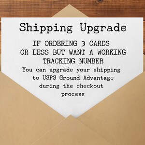May include: A white card with the text "Shipping Upgrade" inside a brown envelope. The card's text explains how to upgrade shipping to USPS Ground Advantage during checkout for orders of three cards or less.