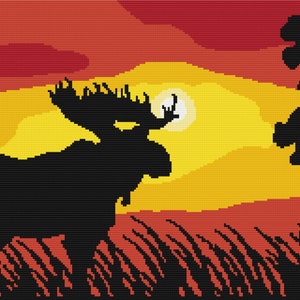 May include: A black silhouette of a moose standing in a field of grass with a red, orange, and yellow sunset in the background.