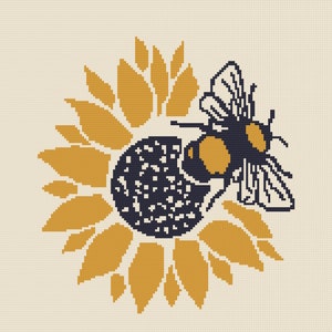 May include: A black and yellow bee with wings outstretched, perched on a yellow sunflower with a dark brown center.