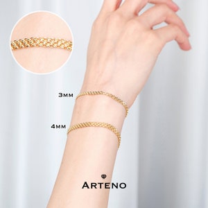 K&ouml;nnte beinhalten: Zwei goldene Kettenarmb&auml;nder am Handgelenk einer Person. Die Armb&auml;nder sind 3 mm und 4 mm breit. Der Text "ARTENO" ist unterhalb der Armb&auml;nder sichtbar.