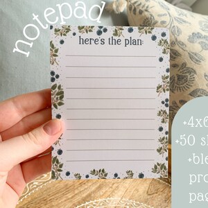May include: A white notepad with a blue and green floral border. The notepad has 50 sheets and is 4x6 inches. The text "here's the plan" is printed at the top of the notepad.