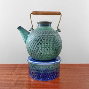 Gustavsberg. Very rare turquoise stoneware teapot with warmer. Designed by Stig Lindberg, Sweden 1960s.