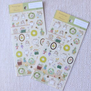 Japanese transparent PET sticker sheets with many cute flying squirrel and flower stickers with pretty gold foil details. Meet the cute Japanese flying squirrels enjoying relaxing times as the florist making flower arrangements like bouquets and wreaths for spring and summer. These are perfect for planners, but can be also used for example to decorate cards or gifts.