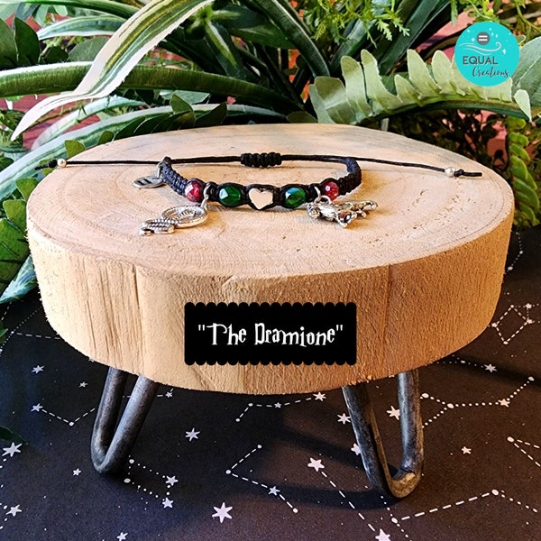 The Dramione Wizard Bracelet Black Cording Green Glass Beads Deep Red Glass Beads Silver Heart Bead Silver Snake Charm Silver Lion Charm