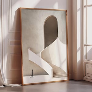 May include: A framed art print featuring a minimalist architectural design. The artwork depicts a white staircase and a curved wall with an archway. A small silhouette of a person is walking on the ground. The frame is a warm gold color.