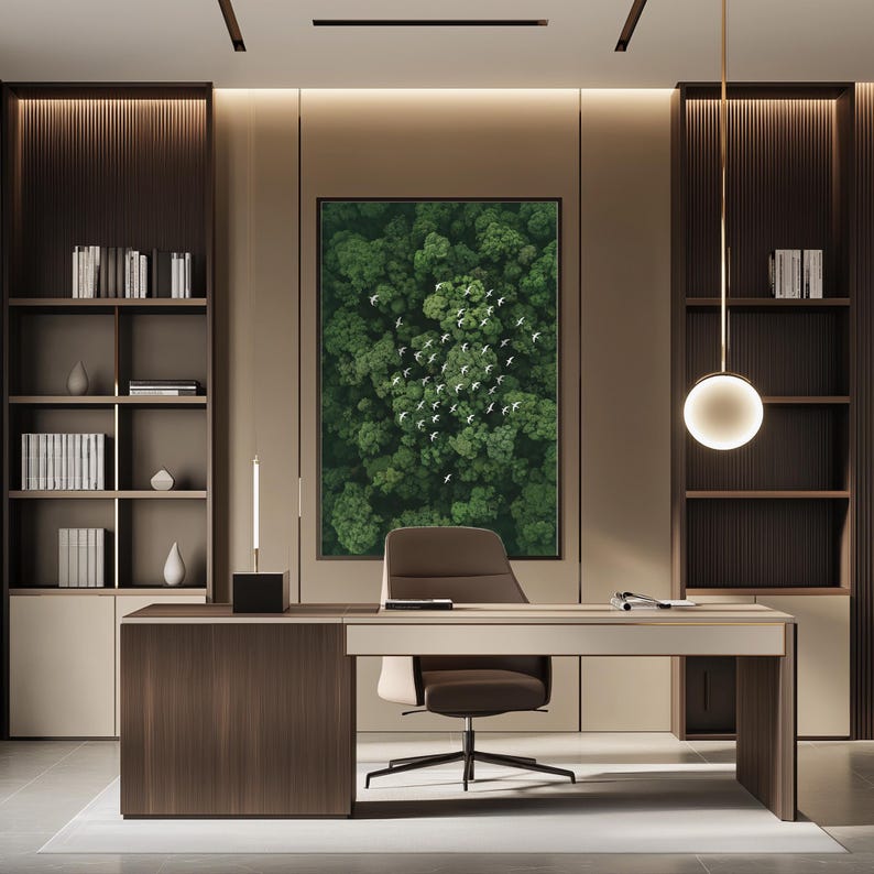 a modern and minimalist office space with a large window that allows natural light to flood the room. The office features a wooden desk with a comfortable chair, and a large abstract painting of a forest scene above it. The room is also equipped with built-in bookshelves and a hanging light fixture, creating a cohesive and stylish workspace.