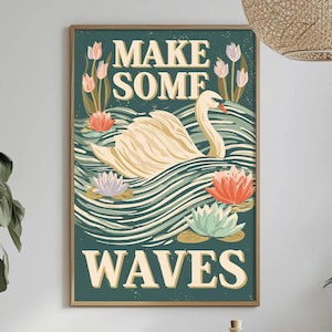 May include: A rectangular wall art print featuring a white swan swimming in dark teal water with stylized waves. The text "MAKE SOME" appears at the top and "WAVES" at the bottom in cream-colored letters. Pink and light blue water lilies surround the swan.