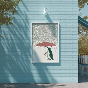 a penguin holding an umbrella, standing on a brick wall.